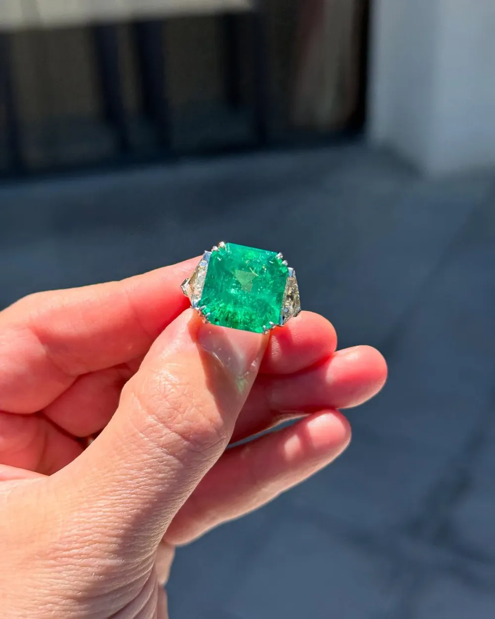 Emerald ring held up to the light