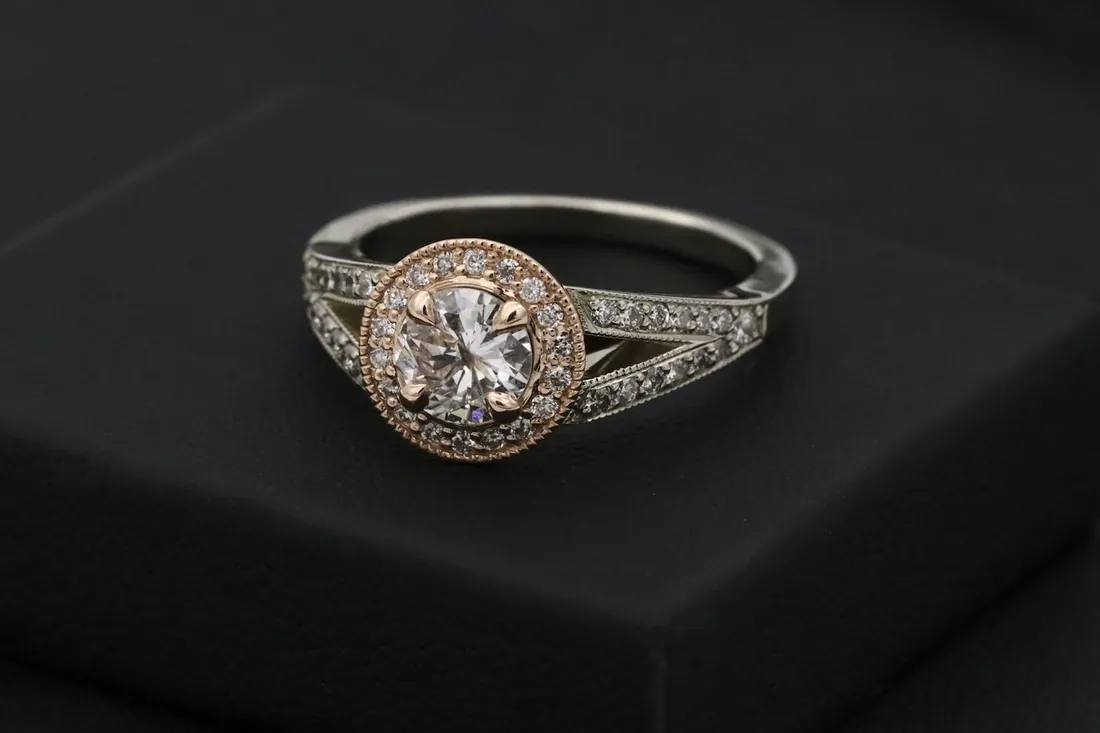Halo diamond engagement ring on black