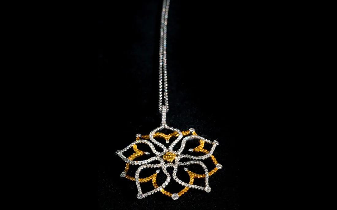 Diamond starburst pendant on a chain